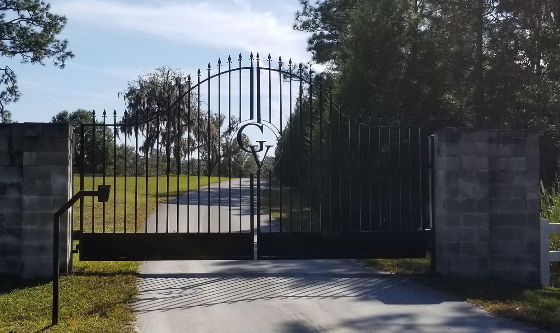 Black ornate metal entrance gate at Grandview Clydesdales